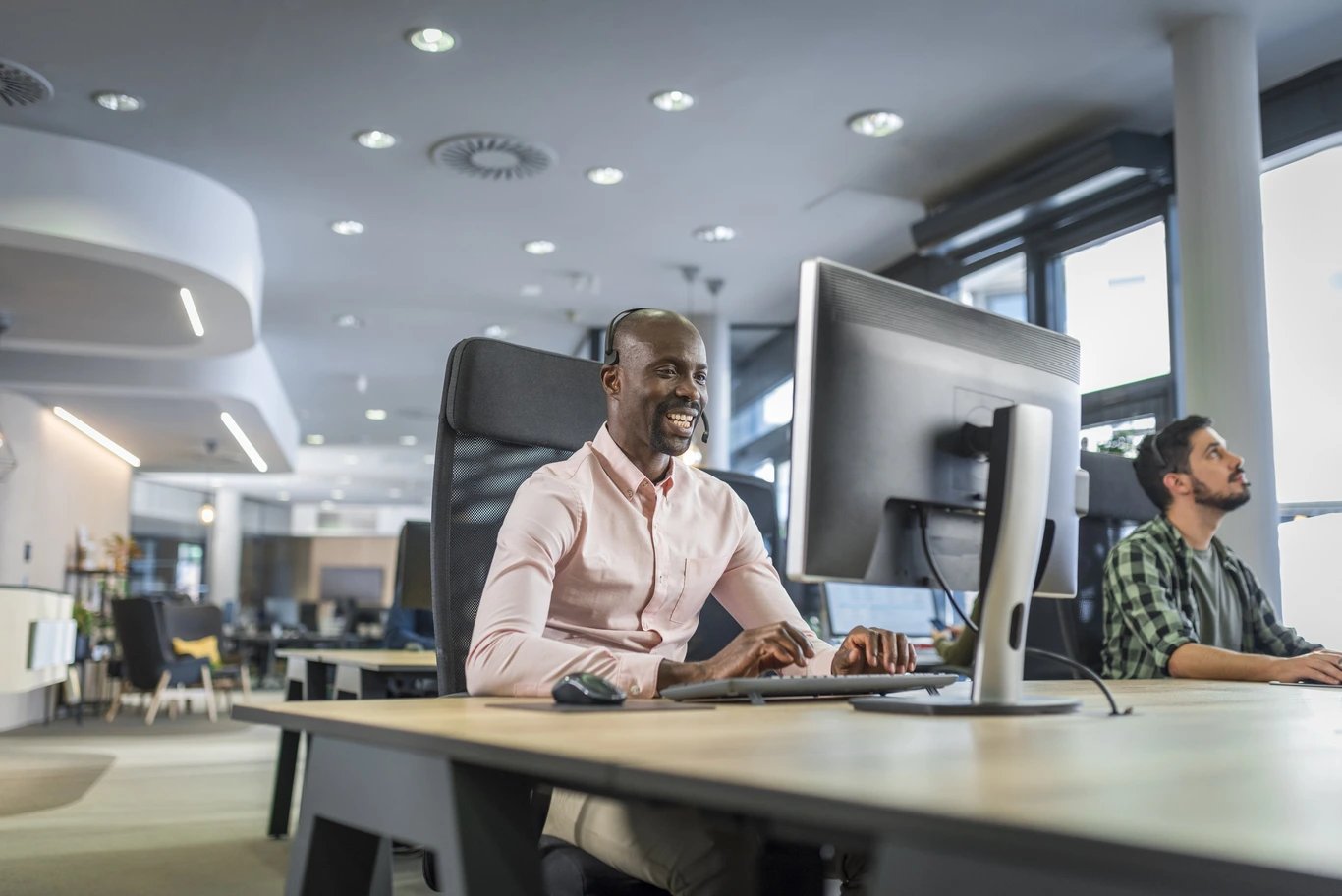 man-in-office-looking-at-computer