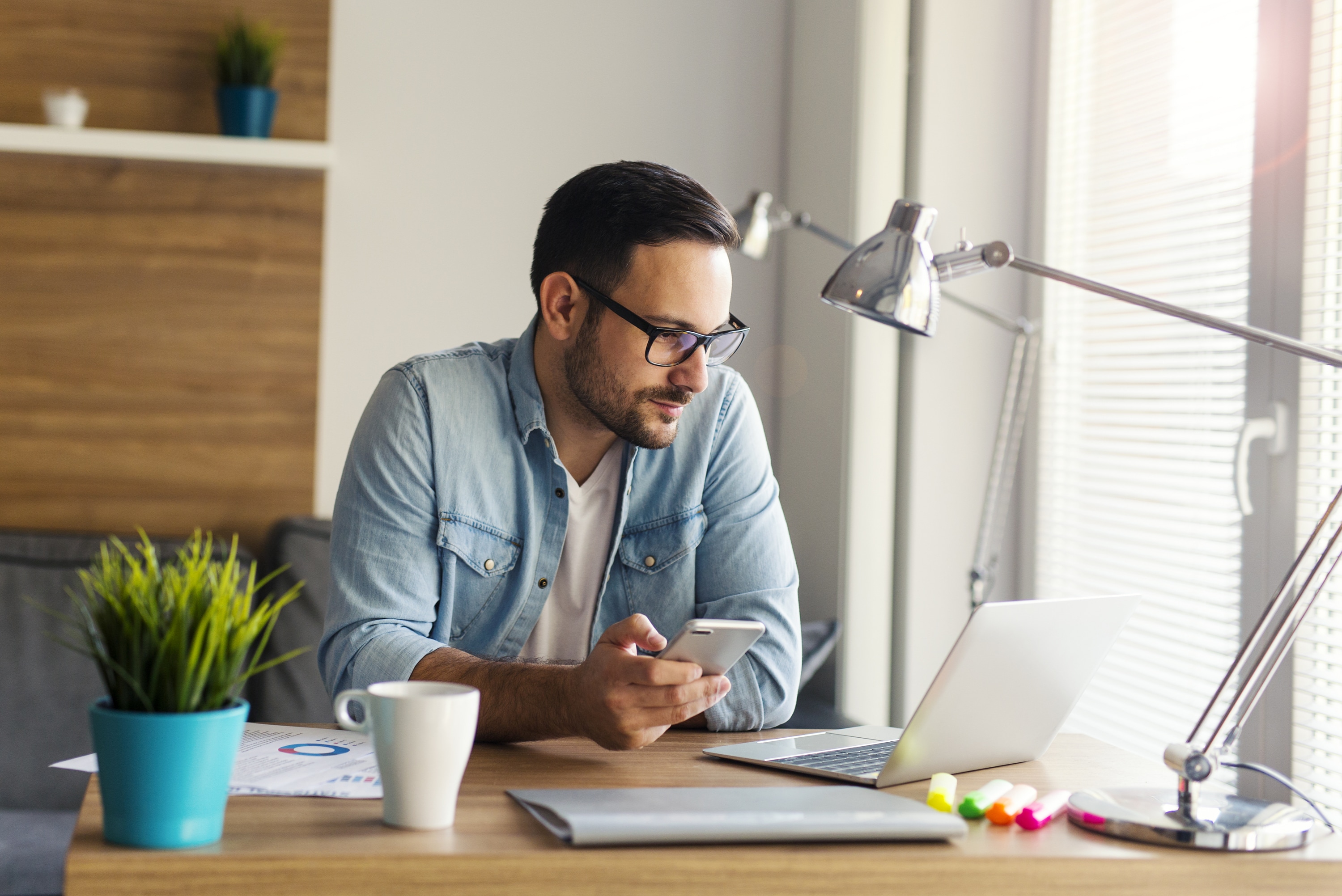 man-working-from-home-laptop-phone (1)