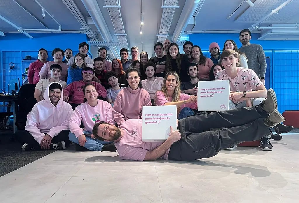 People in the uContact office showing off on pink shirt day